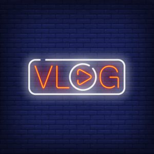 Vlog neon sign. Bright text with letter O in shape of play button. Night bright advertisement. Vector illustration in neon style for web television and blogging